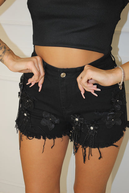 Shorts con fiori neri