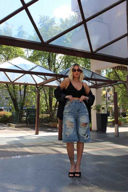 Jeans bermuda strappato